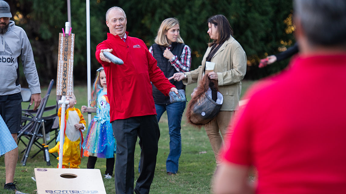 President Killingsworth competes in the Cornhole Tournament